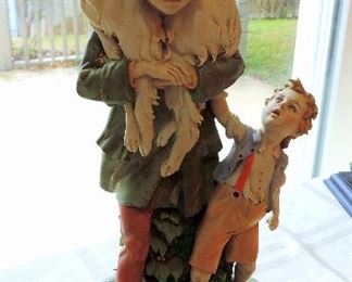STATUE OF CHILD AND DOGS