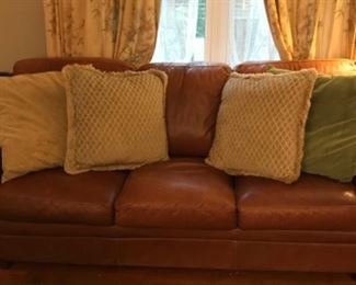 Sofa, pillows, curtains.