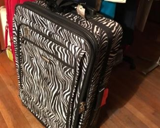 Zebra print suitcase.