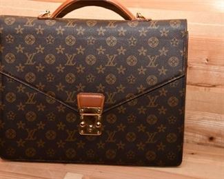 77. Louis Vuitton Logo Briefcase