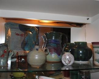 Assorted signed pottery pieces throughout the house.