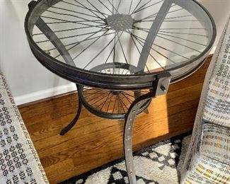 Rustic reclaimed bike wheel table
