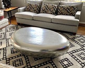 Andy Staczak Interiors / Riverstone Cocktail table in silver leaf.  Sculptural centerpiece was in resin.  55"w x 34"d x 17" h.