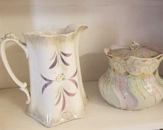 Lot # 52 - $40  Pitcher and Bowl with lid.  Pitcher Label is The Semivitreous Porcelain Wellsville USA