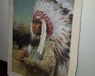 Lot # 194 - $65  Indian Chief Art (Done on Fabric with Pieces of War Bonnet layered on the Fabric)  Pic does not do show it clearly.  