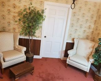 Pair , like new wing back cream colored chairs
