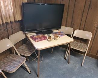 Flat screen TVs, card tables and chairs
