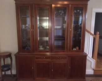 This is a more contemporary china cabinet, cherry wood about 7.5 ft tall and around 7 ft wide. $395