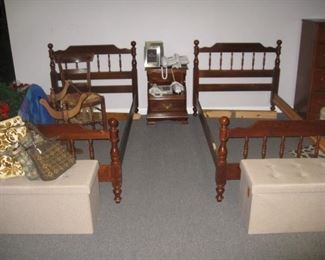 pair of twin beds and nightstand