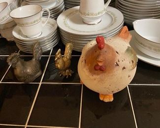 Brass roosters, wooden roosters