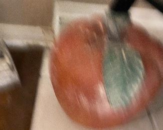 A very blurry big wooden Apple