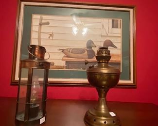 Brass lanterns and large duck painting
