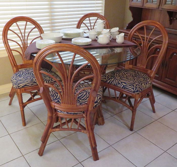 Rattan table with glass top and four (4) chairs