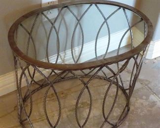 Metal oval table with glass top