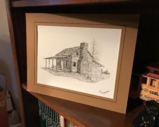 Autographed drawing of log house