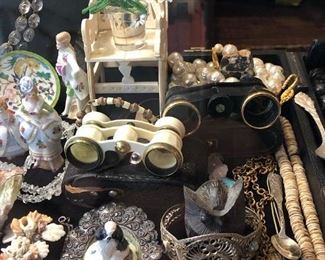 Front table: Assortment of Sterling, Vintage costume jewelry, Chinese Jade toggle set, Tortoise Shell Style cigarette holder, Limoges heart trinket box, Limoges mini vase, antique snuff bottle, vintage beaded and embroidered Victorian clutches, Bone and stone horsehair brushes, mini wedgewood plates, reconstituted amber figures, vintage Scully men’s wallet, vintage cinnabar Chinese export filigree adjustable ring, cinnabar trinket box, Freemason amulets, Freemason pin, Shriner Pendant, Shriner tie clip, Armani sunglasses, Meissen mini cat plate, embroidered shoulder epaulets, Armani sunglasses, Spes Mea Ancient Scottish Rite 32 Freemasonry Antique Charm, New Zealand carved tiki figures, red coral oversized bead. 

Chinese Cloisonne Pendant With Magnifying Lense Swivel Koi Fish,Versace bottle stopper, Filigree panel bracelet, various seahorses, Asian filigree bone and silver ring, Yak horn bird sculpture, sniffer scissors, Masonic Temple Chicago collectible spoon, Rolex collectible spoo
