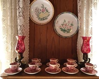 cranberry lamps, tea cups and saucers, decorative plates