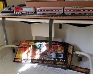 Rail King train set on top of metal canvas bathing cart