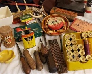 Older wood handle tools, ammo, frankhoma ashtray, old tinsel, hunting badges, sharpening stones, horns, vintage cameras, Etc