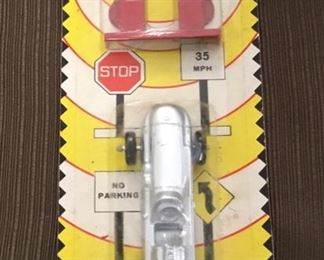 RARE FIND 1950s MIDGETOY Die-Cast Grey Race Car in original package in excellent condition. This item is Made in USA.