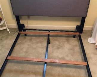 This full size bed features a fabric headboard with studded buttons around the top and sides. Comes with a full frame. Very nice.... like new.