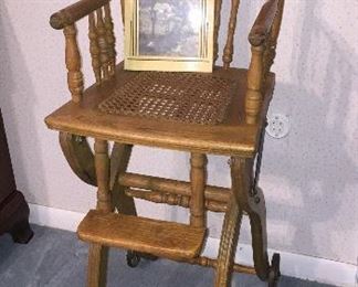 ANTIQUE PRESSED BACK HIGH CHAIR W/WHEELS