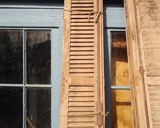 Antique French pine shutters put together with pegs. 2 sets of 4 panels each