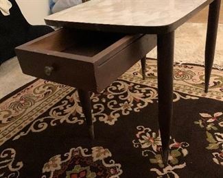 End table with laminate top and drawer $25