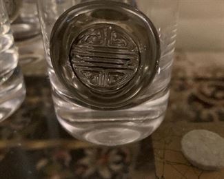 Set of eight large drinking glasses with Asian disk on front $12