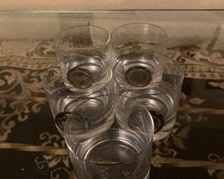 Set of five small drinking glasses with Asian disk on front $8