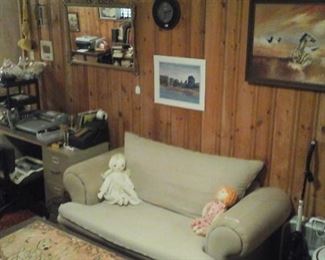 One of two pull out sleeper love seats