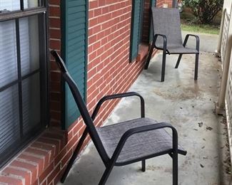 New lawn chairs on front porch.