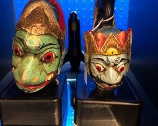 Antique puppet heads on stands