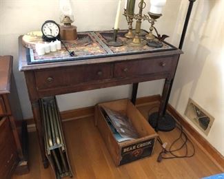 Lamps, candle holders, old stand/table.