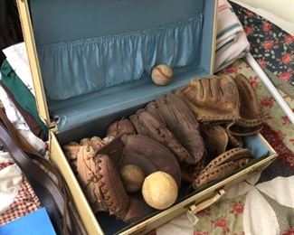 Very old baseball gloves / mitts. 