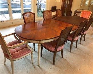 Kindel dining table with three leaves, pads and eight chairs.