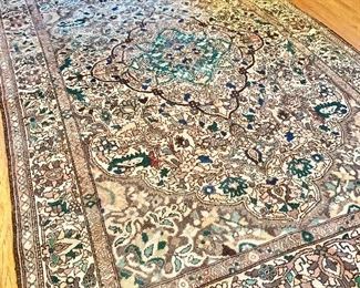 Tabriz handwoven rug.  Classic medallion with soft colors.  6'11" x 10'2"