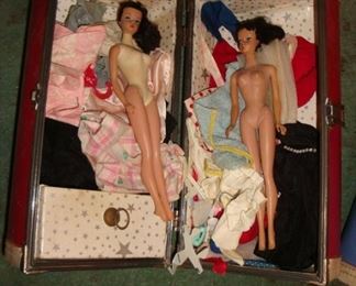 Vintage Barbie Dolls with some hand made clothing outfits.