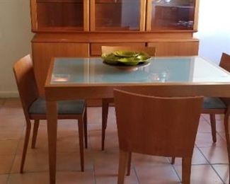 View of mid-century hutch and mid-century dining table and chairs