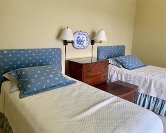 Pair of twin beds with upholstered headboards