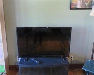 Insignia TV with Cabinet, Floor Lamp