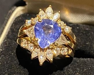 Estate Ring. Pear Shaped Tanzanite stone setting with two trilliant cut diamonds 14k gold ring with 14k gold enhancer ring with six small marquise cut diamonds and eight small round brilliant cut diamonds. (Photos by BC)