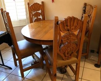 45" Oak Pedestal Table; 4 Intricately Carved Wood/Leather Side Chairs With Nail Head Trim