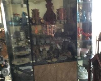 Huge display with curved glass doors on sides, center storage