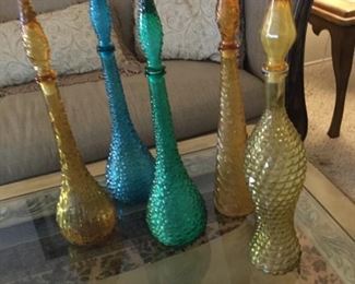 Five tall colored glass bottles, fun!