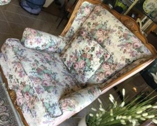 Wing back chair matches loveseat, floral with applied trim on wood