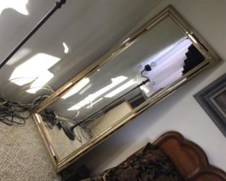 Gold and silver trim on full length mirror