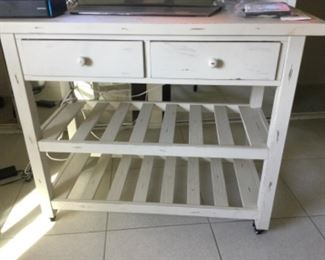 Kitchen style table with slatted shelves