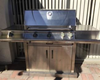 Barbecue is clean inside, has propane tank, accessories inside base