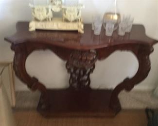 Oops blurry operator but lovely heavily carved console table